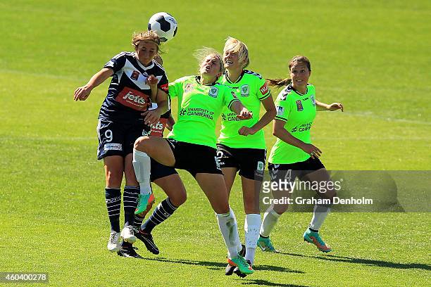 Racheal Quigley of the Victory heads the ball surrounded by the United defence during the W-League Semi Final match between Melbourne Victory and...