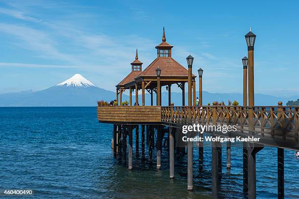 Pier in Frutillar, a small town on Lake Llanquihue in the Lake District near Puerto Montt, Chile with Osorno Volcano in background.