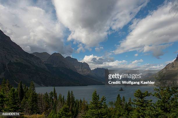 View of Wild Goose Island in Saint Mary Lake with dramatic clouds in Glacier National Park, Montana, United States.