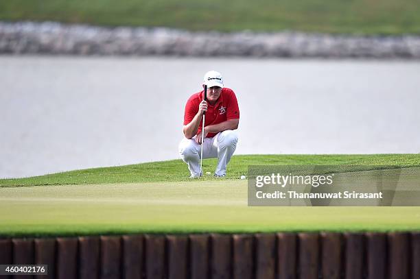 Marcus Fraser of Australia plays a shot during round three of the Thailand Golf Championship at Amata Spring Country Club on December 13, 2014 in...