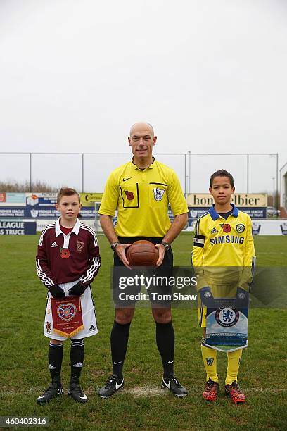 Referee Howard Webb of England poses for a picture with team captains Tyler MacKenzie of Hearts and Ben Elliot of Chelsea during the Premier League...