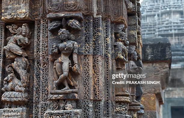 Sculptures on the outer wall are pictured at the Konark Sun temple in Konark, in eastern Orissa state on December 12, 2014. The Konark Sun Temple is...