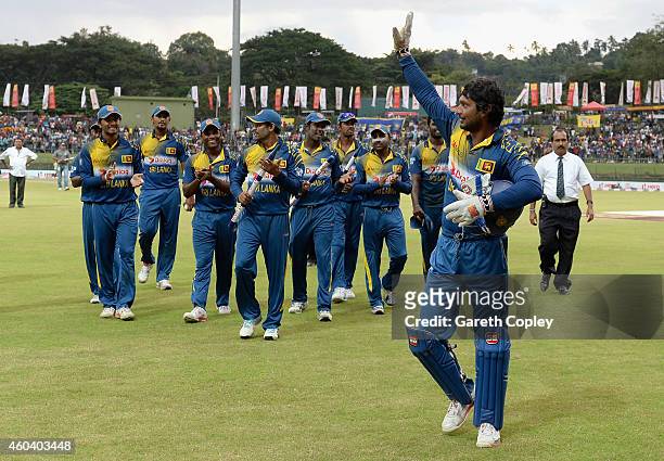 Kumar Sangakkara of Sri Lanka leaves the field after winning the 6th One Day International match between Sri Lanka and England at Pallekele Cricket...