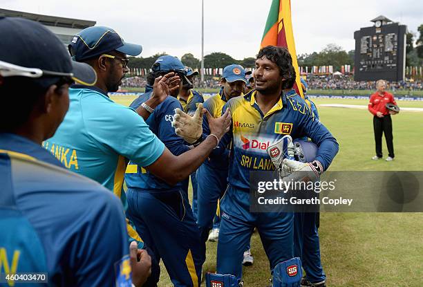 Kumar Sangakkara of Sri Lanka leaves the field after winning the 6th One Day International match between Sri Lanka and England at Pallekele Cricket...