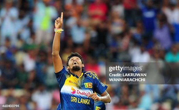 Sri Lankan cricketer Suranga Lakmal celebrates after he dismissed England cricketer James Tredwell during the sixth One Day International match...