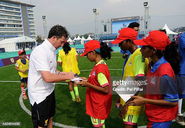 Robbie Fowler, Liverpool legend signs autographs for the winners of a contest during the Barclays Premier League 'Live' event on December 13, 2014 in...