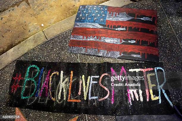 Peaceful protesters gather on Hollywood Boulevard to protest the jury decisions not to indict police officers involved in the deaths of black people,...