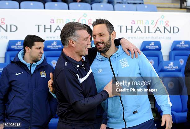 Leicester City manager Nigel Pearson welcomes Richard Wright of Manchester City to the King Power Stadium ahead of the Barclays premier League match...