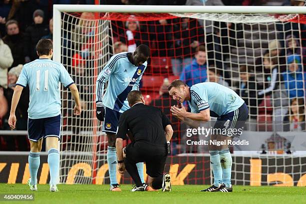 Kevin Nolan of West Ham remonstrates with referee Phil Dowd after he awarded a penalty to Sunderland during the Barclays Premier League match between...