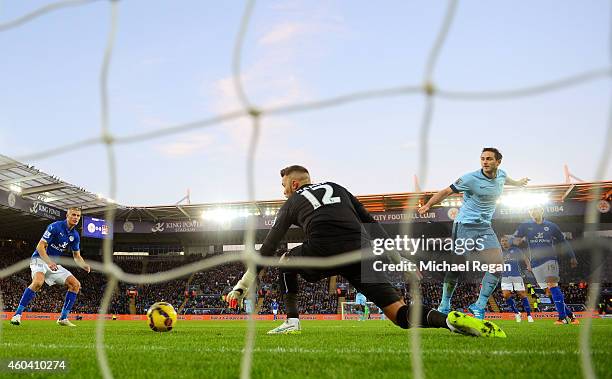 Frank Lampard of Manchester City scores the opening goal past goalkeeper Ben Hamer of Leicester City during the Barclays Premier League match between...