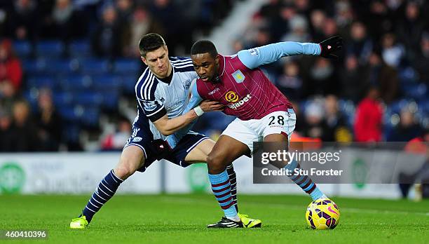 Player Sebastien Pocognoli challenges Charles N' Zogbia of Villa during the Barclays Premier League match between West Bromwich Albion and Aston...