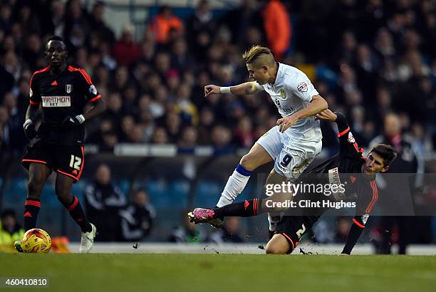 Adryan of Leeds United is tackled by Emerson Hyndman of Fulham during the Sky Bet Championship match between Leeds United and Fulham at Elland Road...