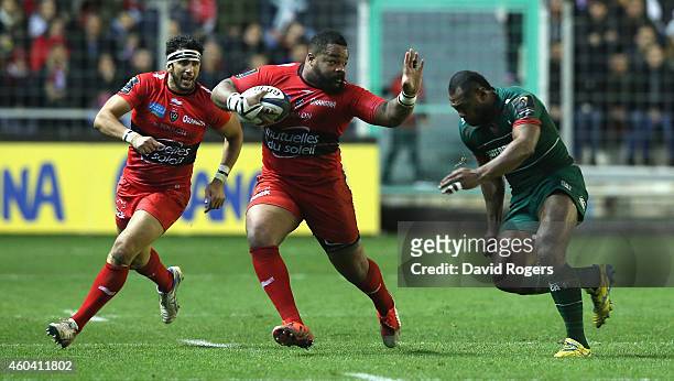 Mathieu Bastareaud of Toulon is tackled by Vereniki Goneva during the European Rugby Champions Cup pool three match between RC Toulon and Leicester...