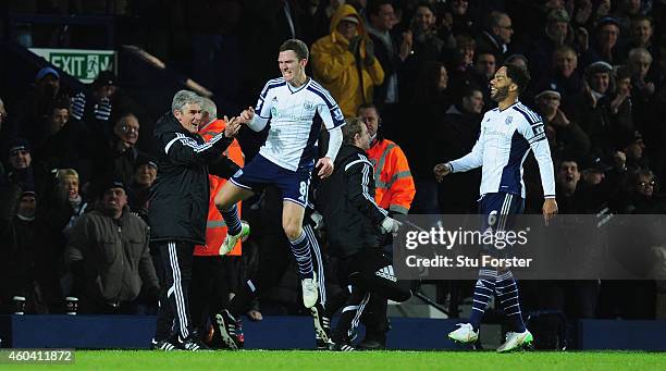Player Craig Gardner celebrates his goal with manager Alan Irvine during the Barclays Premier League match between West Bromwich Albion and Aston...