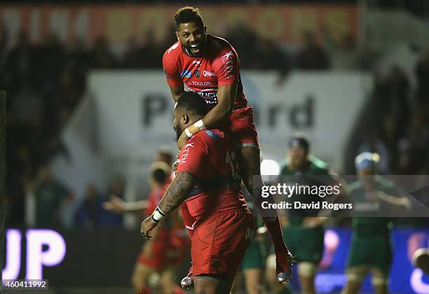 Mathieu Bastareaud of Toulon is congratulated by team mate Delon Armitage after scoring a try during the European Rugby Champions Cup pool three...