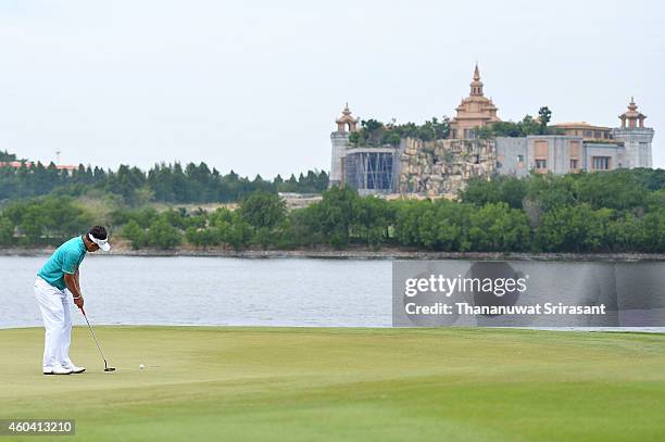 Thongchai Jaidee of Thailand plays a shot during round three of the Thailand Golf Championship at Amata Spring Country Club on December 13, 2014 in...