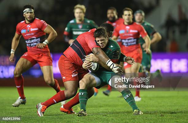 Anthony Allen of Leicester is tackled by Mathieu Bastareaud during the European Rugby Champions Cup pool three match between RC Toulon and Leicester...