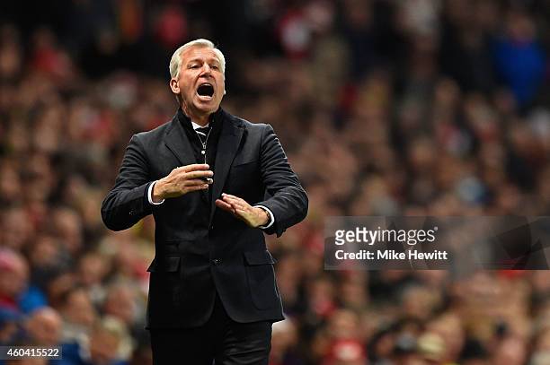 Alan Pardew, manager of Newcastle United gives instructions during the Barclays Premier League match between Arsenal and Newcastle United at Emirates...