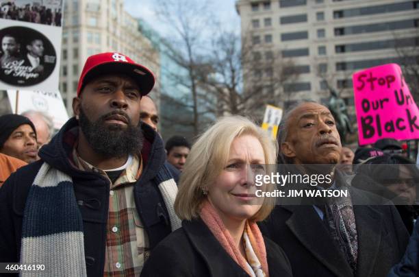 Michael Brown Sr. , the father of Ferguson shooting victim Michael Brown, stands with US Senator Kirsten Gillibrand , D-New York, and Reverend Al...