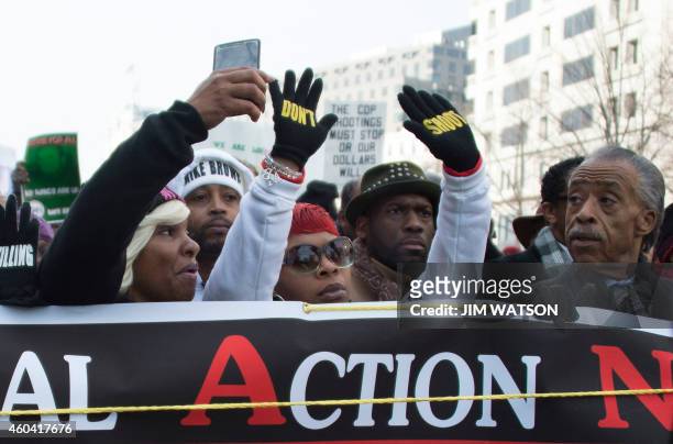 Reverend Al Sharpton and Lesley McSpadden , mother of Ferguson shooting victim Michael Brown, lead the "Justice For All" march in Washington, DC,...