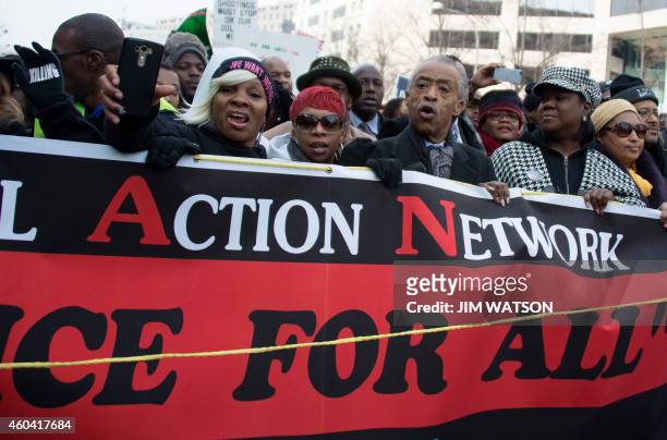 Reverend Al Sharpton and Lesley McSpadden , mother of Ferguson shooting victim Michael Brown, lead the "Justice For All" march in Washington, DC,...