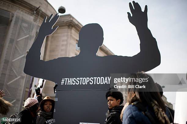 Thousands of protesters participate in the "Justice For All" march against police violence on Pennsylvania Avenue in Washington on Saturday, Dec. 13,...