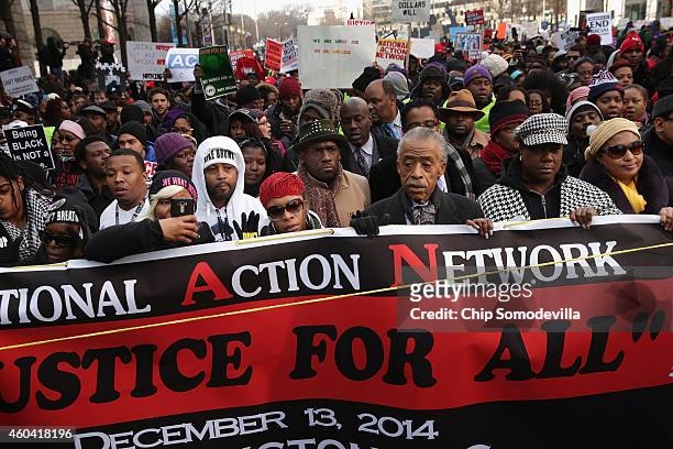 Rev. Al Sharpton leads the "Justice For All" march in the nation's capital with the families of Eric Garner, Michael Brown, Tamir Rice, Trayvon...