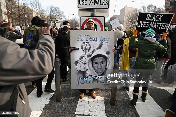 Thousands of people participate in the "Justice For All" rally and march in the nation's capital against police brutality and the killing of unarmed...
