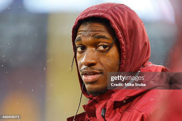 Robert Griffin III of the Washington Redskins looks on during the game against the New York Giants at MetLife Stadium on December 29, 2013 in East...