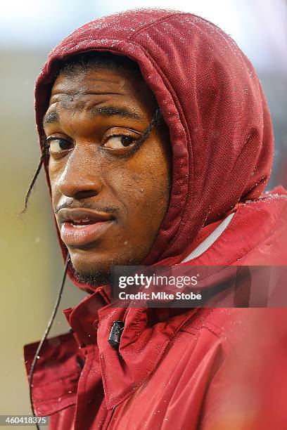 Robert Griffin III of the Washington Redskins looks on during the game against the New York Giants at MetLife Stadium on December 29, 2013 in East...