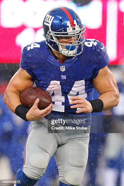 Peyton Hillis of the New York Giants in action against the Washington Redskins at MetLife Stadium on December 29, 2013 in East Rutherford, New...