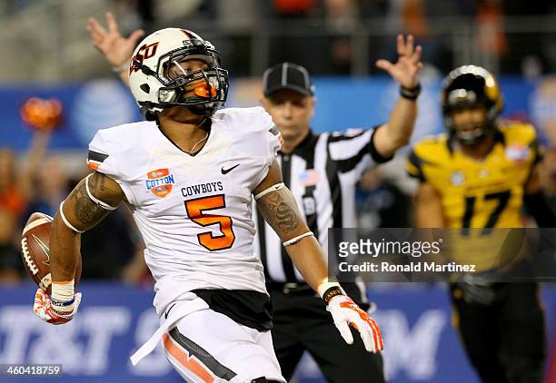Wide receiver Josh Stewart of the Oklahoma State Cowboys scores a touchdown on a 40-yard catch in the first half while taking on the Missouri Tigers...