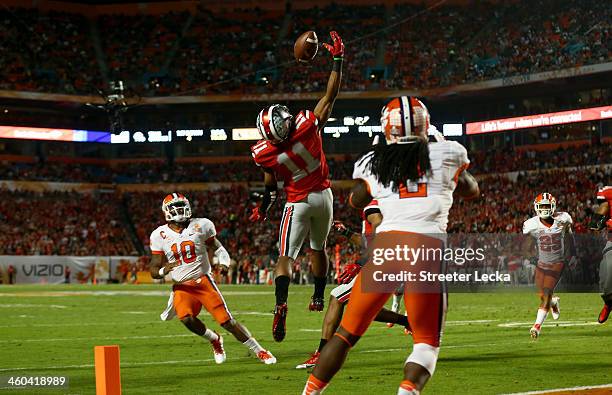 Vonn Bell of the Ohio State Buckeyes intercepts a pass thrown by Tajh Boyd of the Clemson Tigers in the second quarter during the Discover Orange...