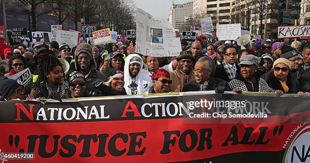 Rev. Al Sharpton leads the "Justice For All" march in the nation's capital with the families of Eric Garner, Michael Brown, Tamir Rice, Trayvon...