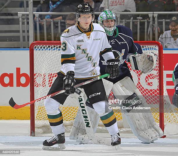 Julius Bergman of the London Knights waits to tip a shot at Alex Nedeljkovic of the Plymouth Whalers in an OHL game at Budweiser Gardens on December...