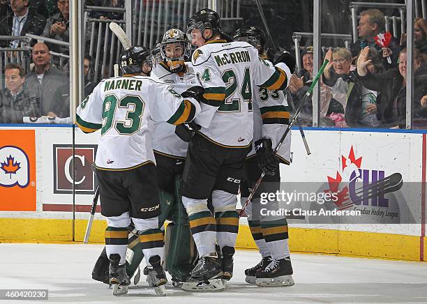 Julius Bergman of the London Knights is mobbed by his teammates after scoring a long empty net goal against the Plymouth Whalers in an OHL game at...