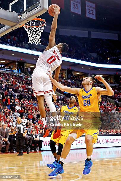 Angelo Russell of the Ohio State Buckeyes dunks the ball while being guarded by Billy Reader of the Morehead State Eagles during the second half at...