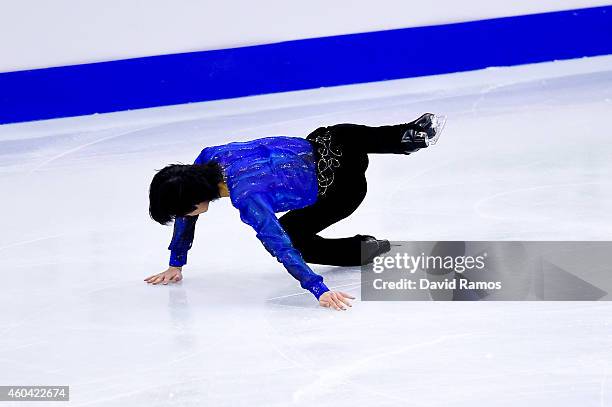 Tatsuki Machida of Japan falls down as he competes in the Ice Men Free Skating Final during day three of the ISU Grand Prix of Figure Skating Final...