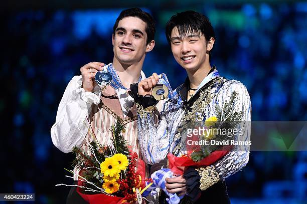 Javier Fernandez of Spain and Yuzuru Hanyu of Japan pose for the media during the medals ceremony during day three of the ISU Grand Prix of Figure...