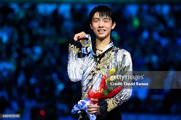 Yuzuru Hanyu of Japan pose for the media during the medals ceremony during day three of the ISU Grand Prix of Figure Skating Final 2014/2015 at...