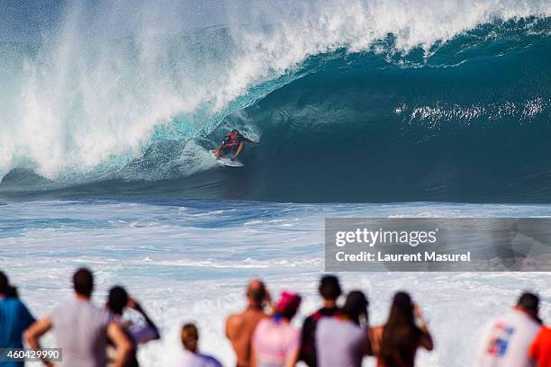 Raoni Monteiro on a barrel during Round 2 of the Billabong Pipe Masters on December 13, 2014 in North Shore, Hawaii.