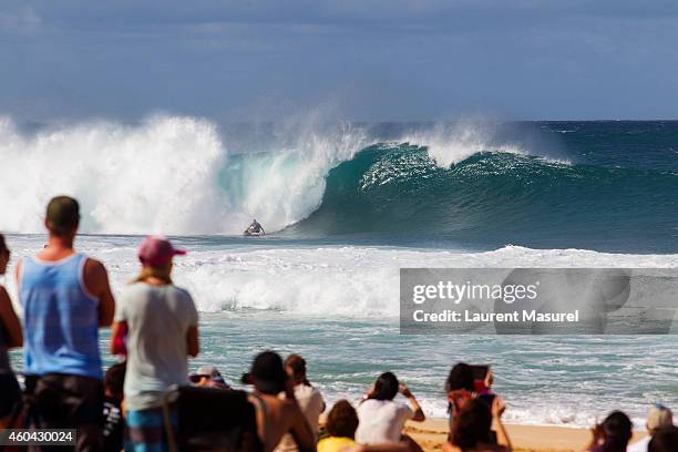 Tiago Pires on bottom-turn during Round 2 of the Billabong Pipe Masters on December 13, 2014 in North Shore, Hawaii.