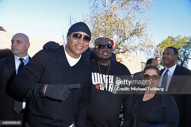 Actor LL Cool J and Worldstar Hip-Hop founder Lee "Q" O'Denat pose at Worldstar Foundation's 2nd Annual Skid Row Christmas Giveaway at Rotary House...