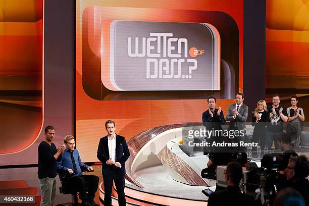 Til Schweiger, Samuel Koch and TV host Markus Lanz are seen on stage at the last broadcast of the Wetten, dass..?? tv show on December 13, 2014 in...