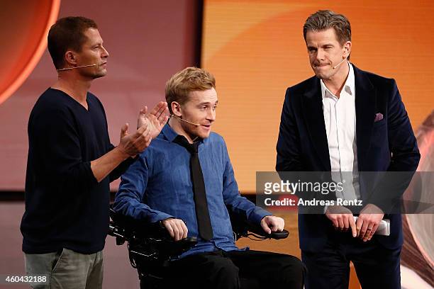 Til Schweiger, Samuel Koch and TV host Markus Lanz are seen on stage at the last broadcast of the Wetten, dass..?? tv show on December 13, 2014 in...