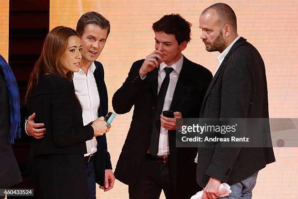 Host Markus Lanz and his wife Angela Gessmann speak to crew members after the last broadcast of the Wetten, dass..?? tv show on December 13, 2014 in...