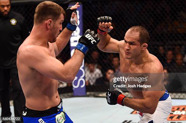 Junior Dos Santos of Brazil punches Stipe Miocic in their heavyweight fight during the UFC Fight Night event at the U.S. Airways Center on December...