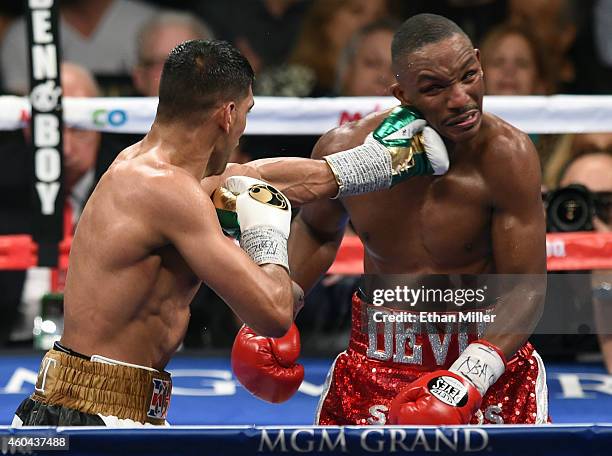 Amir Khan hits Devon Alexander in the sixth round of their welterweight bout at the MGM Grand Garden Arena on December 13, 2014 in Las Vegas, Nevada.