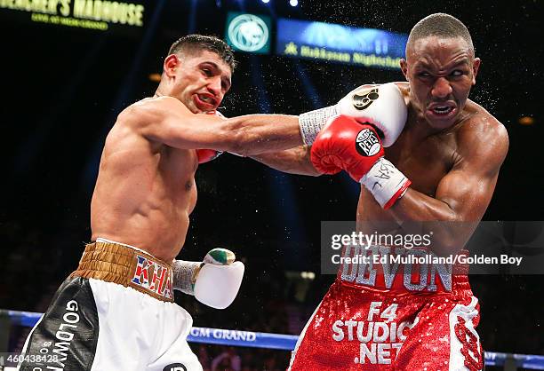 Amir Khan and Devon Alexander trade punches during their welterweight bout at the MGM Grand Garden Arena on December 13, 2014 in Las Vegas, Nevada....