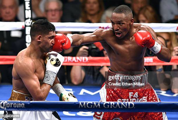 Devon Alexander hits Amir Khan during the 10th round of their welterweight bout at the MGM Grand Garden Arena on December 13, 2014 in Las Vegas,...